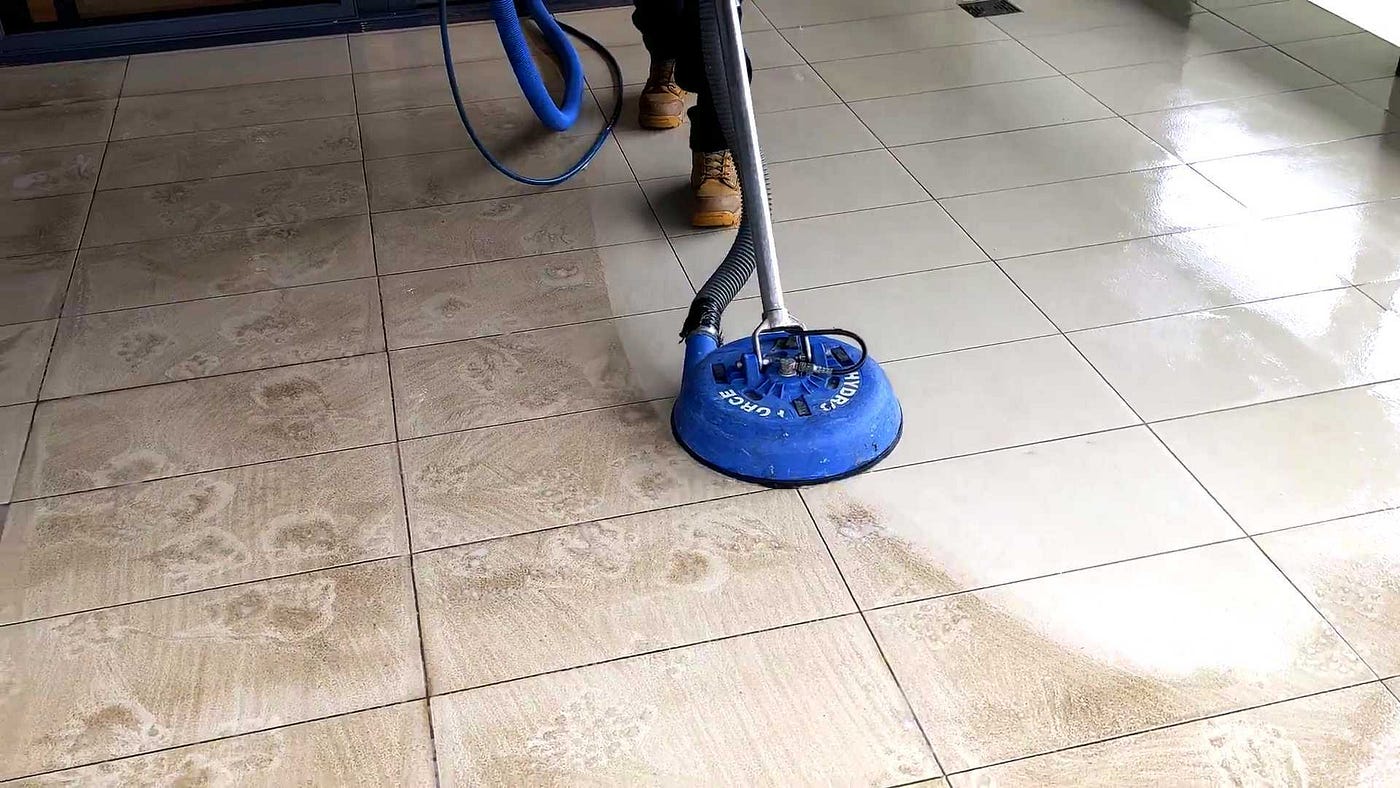 Close-up of grout lines being professionally cleaned to remove embedded dirt.