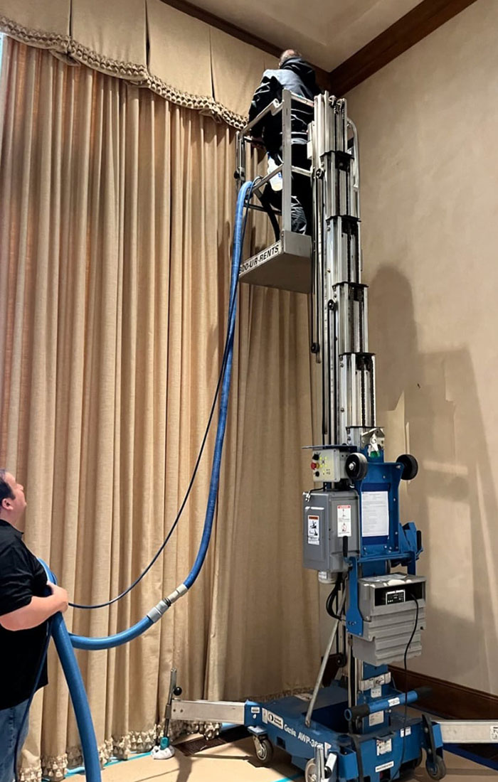 A recliner being sanitized and deodorized during an upholstery cleaning service.