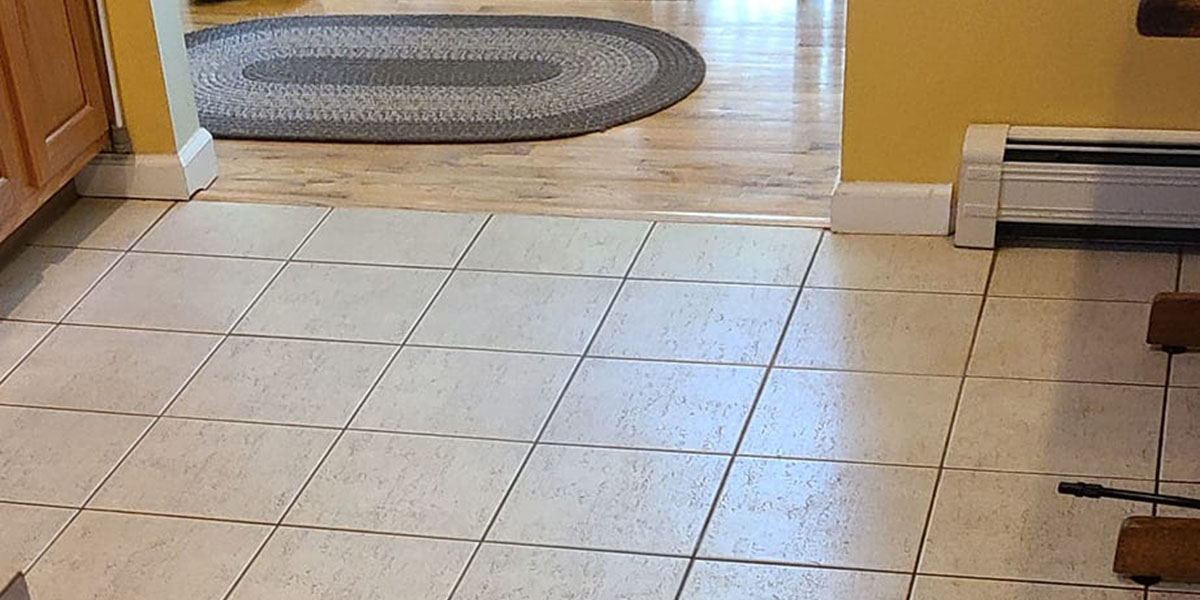 Before-and-after image showing spotless bathroom tiles after deep cleaning.